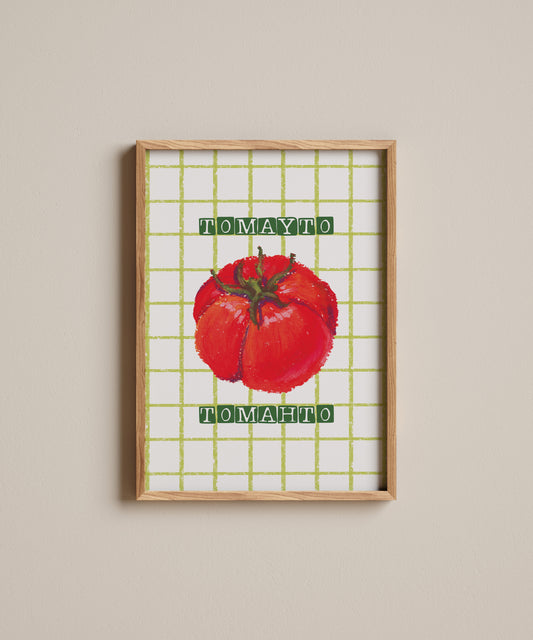 Framed artwork of a red tomato with 'Tomato' text on a grid background.