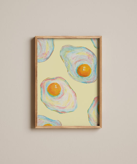 Framed artwork of abstract eggs on a beige wall