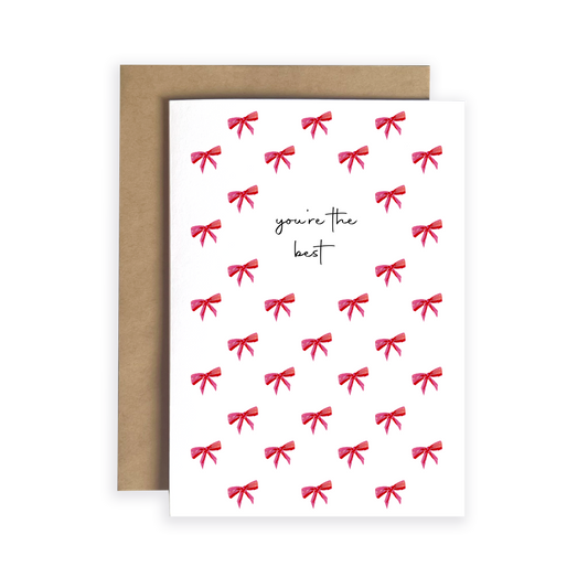 Greeting card with red bows and 'you're the best' text, brown envelope
