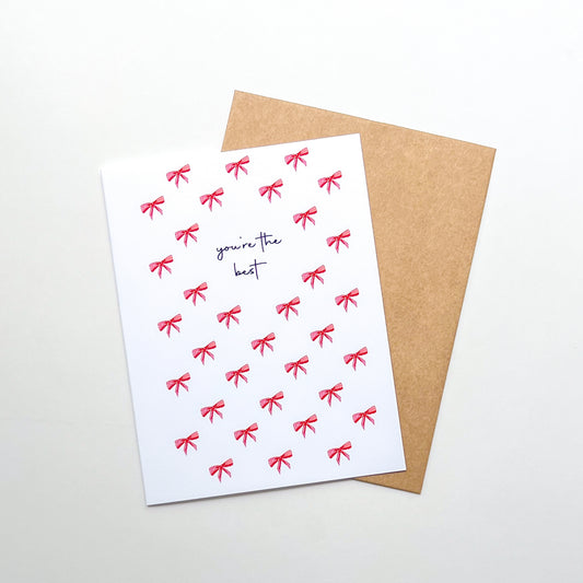 greeting card with illustration of bows and text 'you're the best'
